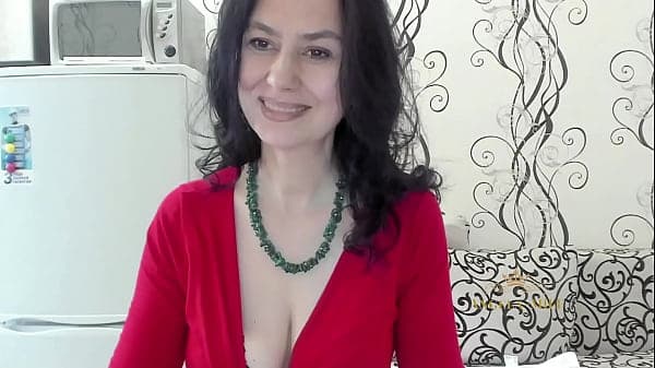 Dark-haired MILF dances slowly