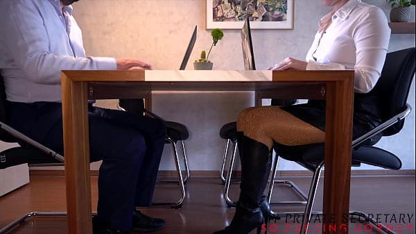 serious business woman seducing the boss with her sexy pantyhose feet